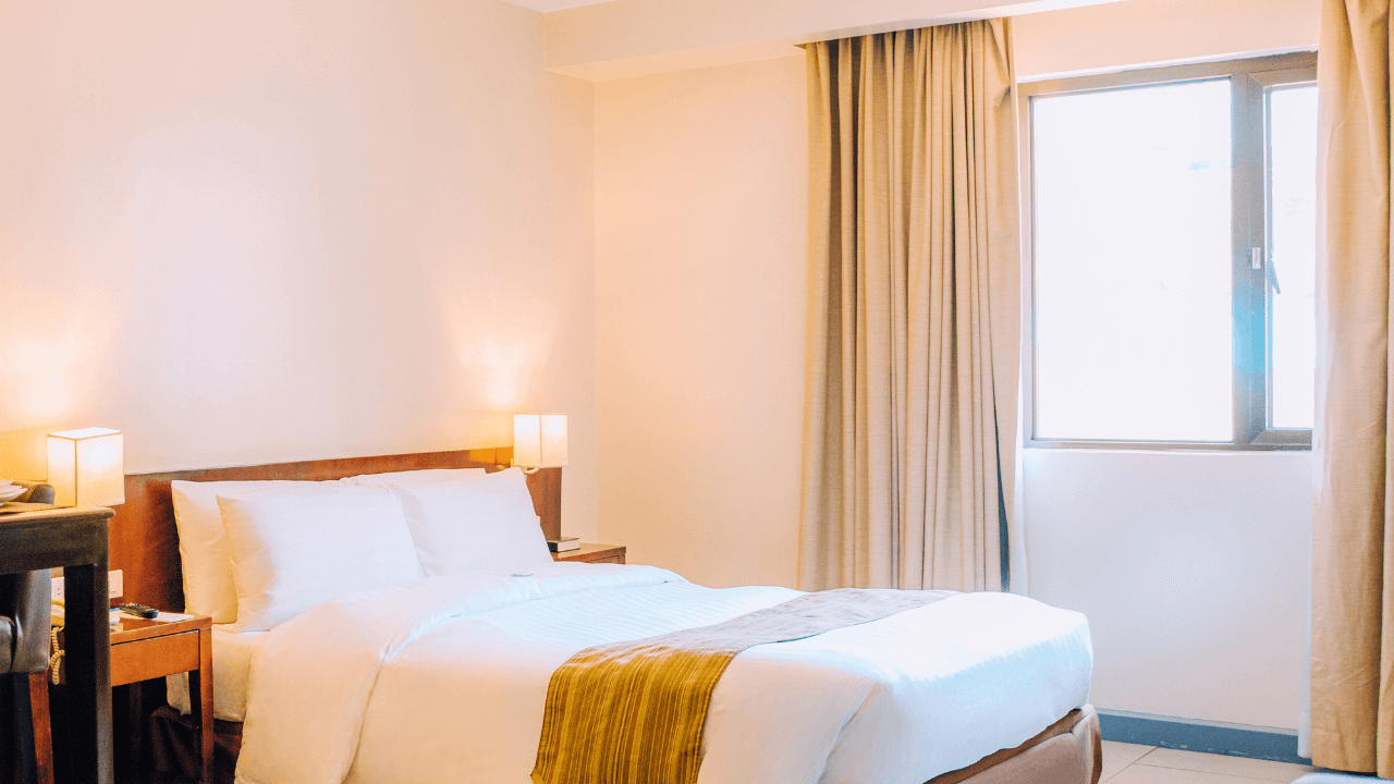 azalea hotels & residences deluxe hotel room bed