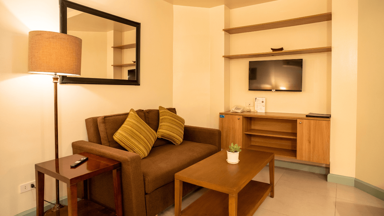 azalea hotels & residences superior room living area